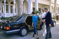rich people entering luxury car
