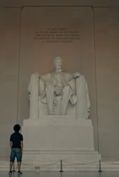 young man shows respect for Lincoln memorial